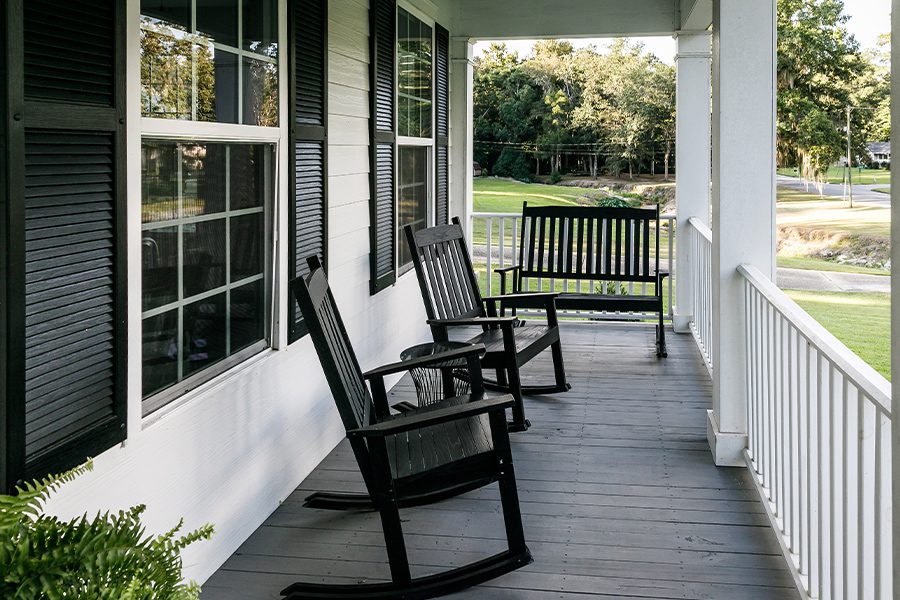 Berwick, PA - Front Porch of Country Home with Black Rocking Chairs and Casual Feel